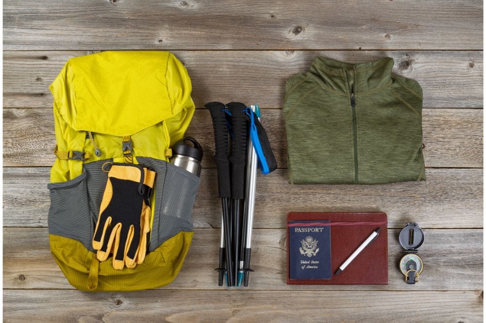 “Backpack and gear layout for camping organization”