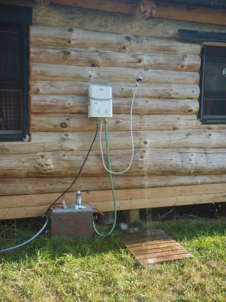 Realistic campsite scene showing a shower setup